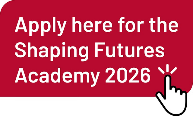 Red button with white text: ‘Apply here for the Shaping Futures Academy 2026’. A hand cursor points to the text.