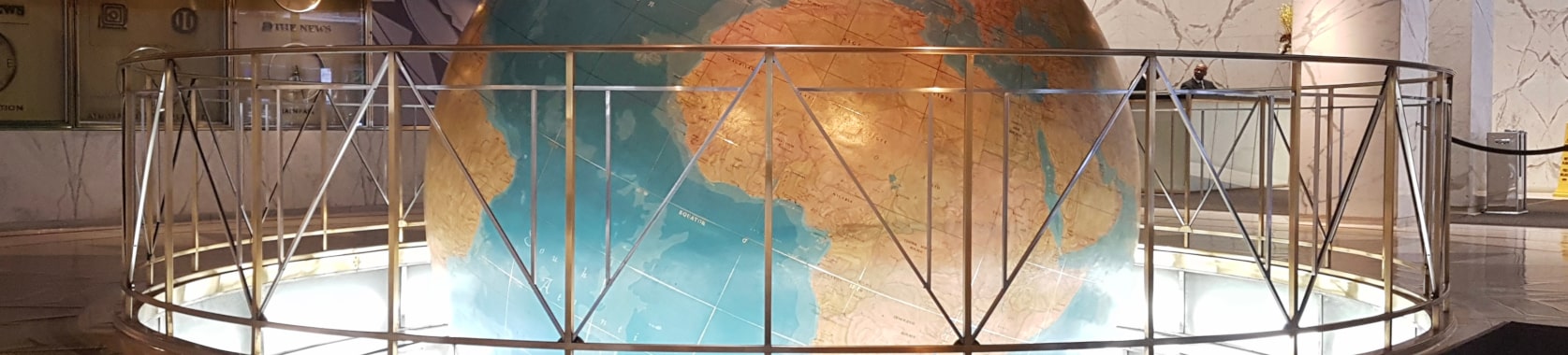 Header image of the special feature, large globe in a UN building.
